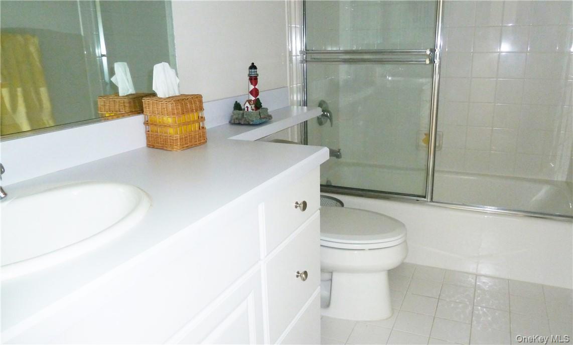 107 Winding Ridge Road, Unit 107 White Plains, NY 10603 - Photo 19 of 30 a bathroom with a sink a toilet and shower
