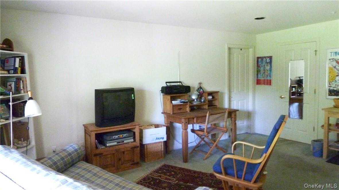 107 Winding Ridge Road, Unit 107 White Plains, NY 10603 - Photo 21 of 30 a view of a workspace with furniture and wooden floor