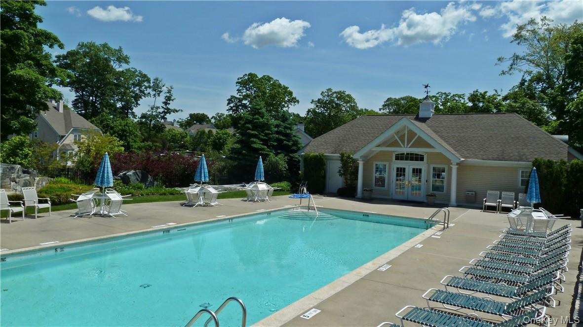 107 Winding Ridge Road, Unit 107 White Plains, NY 10603 - Photo 24 of 30 a front view of a house with a yard