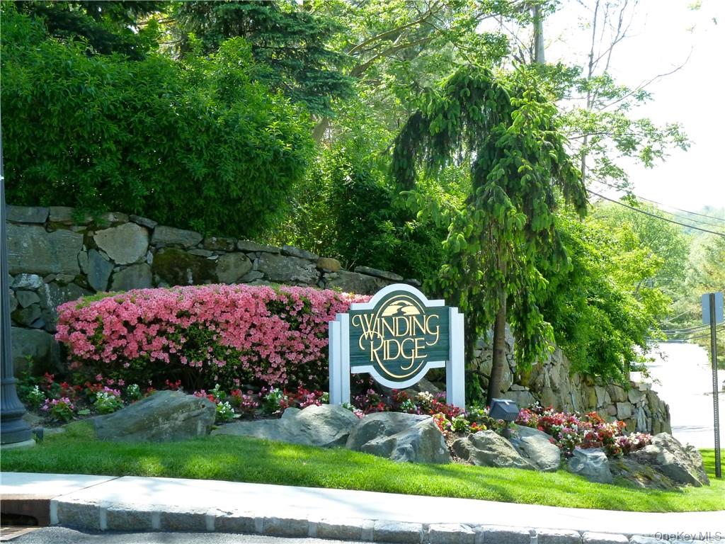 107 Winding Ridge Road, Unit 107 White Plains, NY 10603 - Photo 30 of 30 a sign that is on a field next to a road