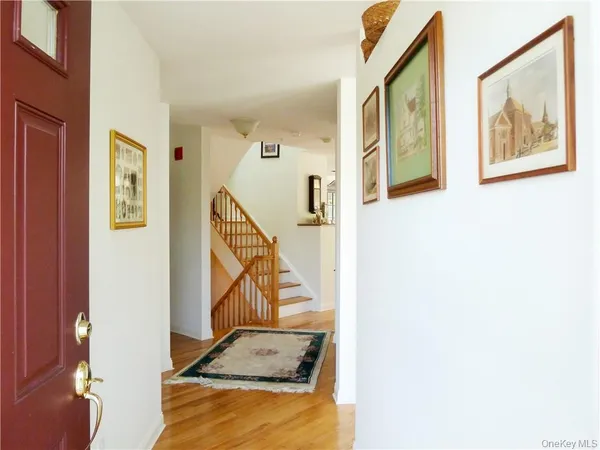 a view of a livingroom with furniture and stairs