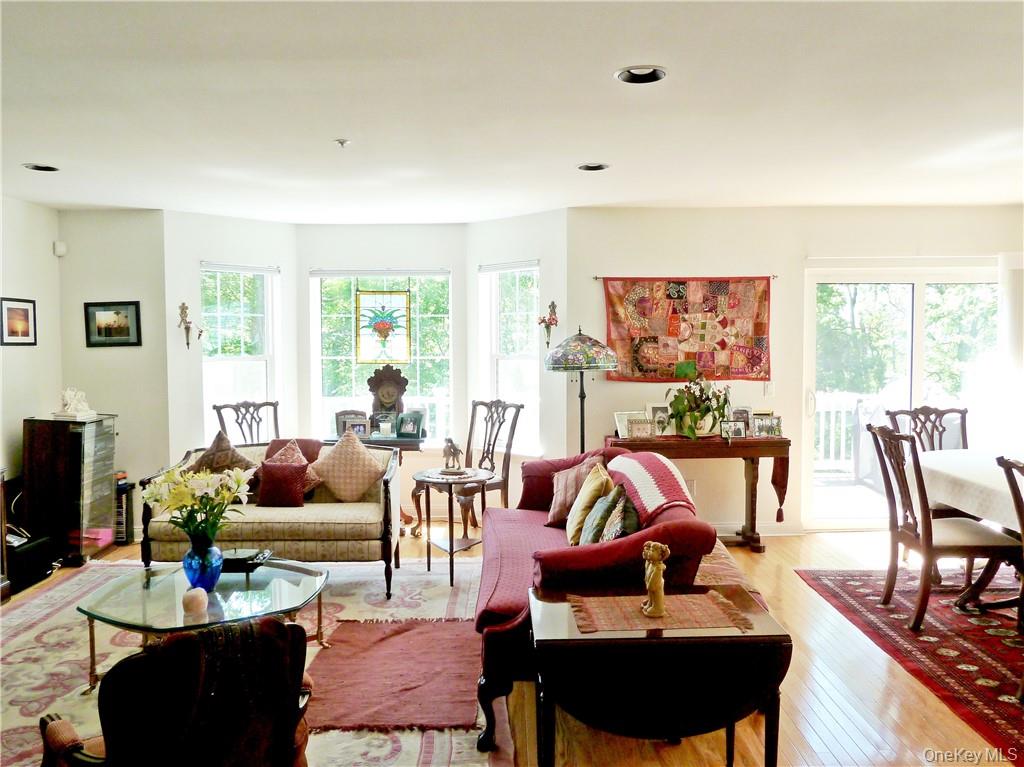 107 Winding Ridge Road, Unit 107 White Plains, NY 10603 - Photo 7 of 30 a living room with furniture and a large window