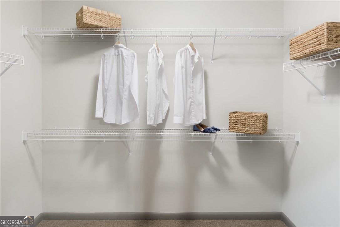 6919 Peachtree Road, Unit 545 Atlanta, GA 30328 - Photo 19 of 38 Spacious closet with carpet