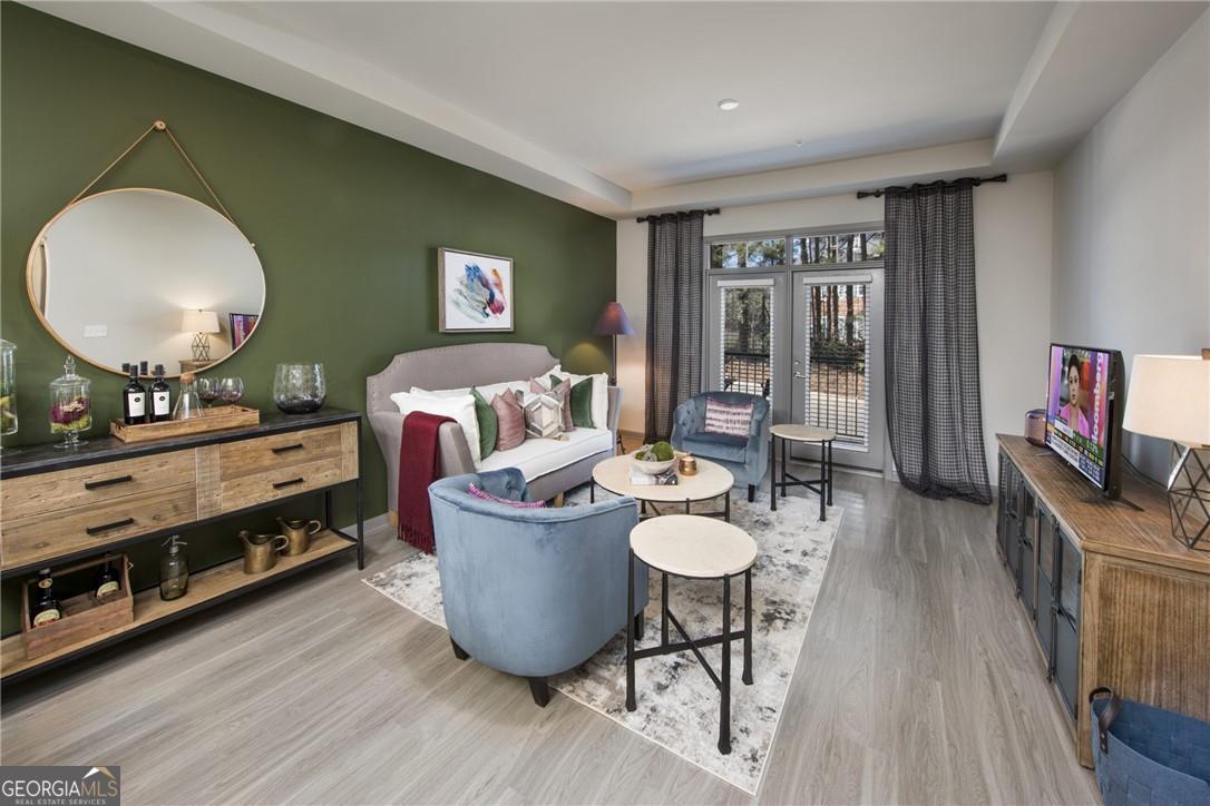 6919 Peachtree Road, Unit 545 Atlanta, GA 30328 - Photo 9 of 38 Living room with light hardwood / wood-style floors