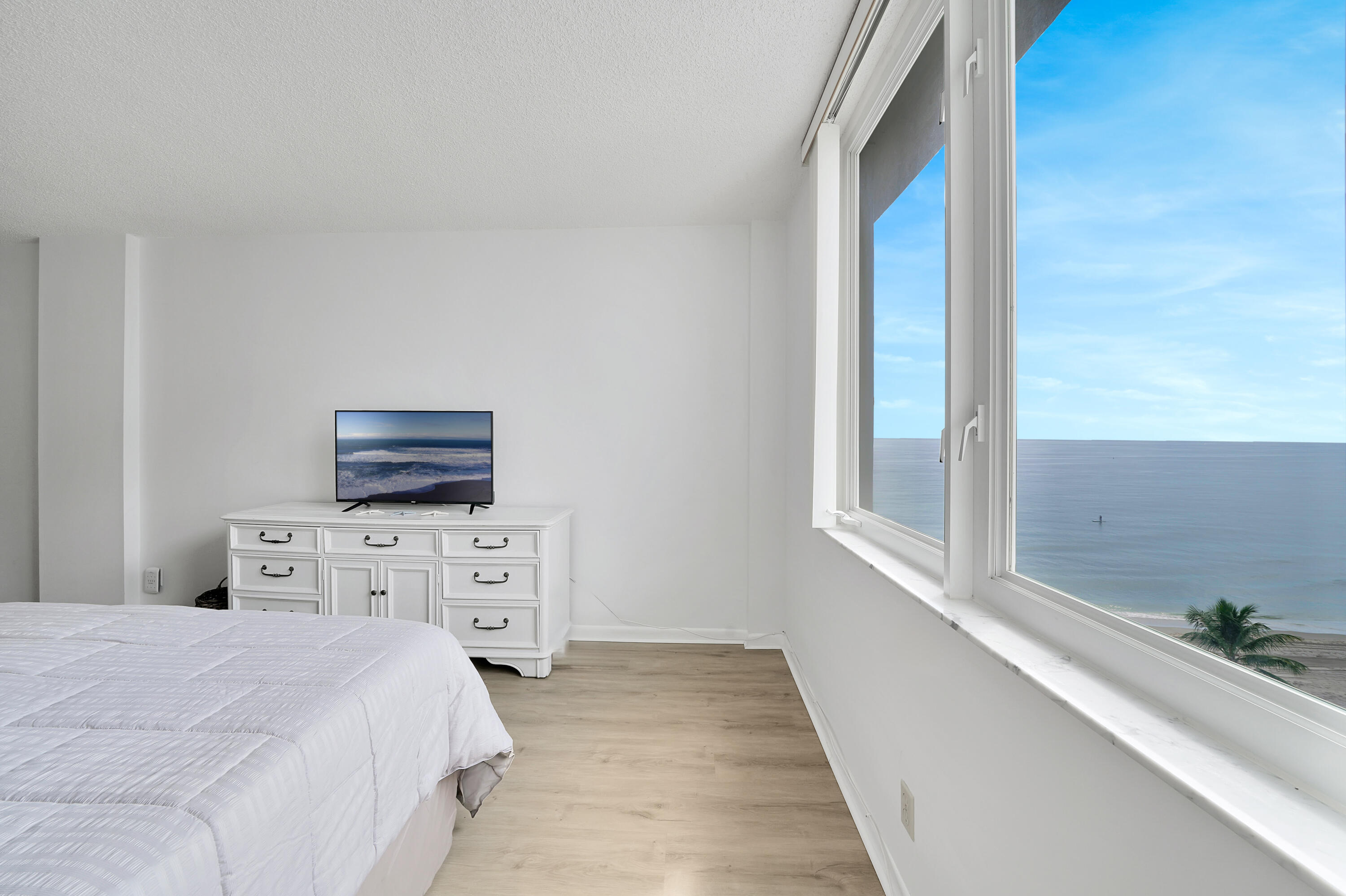 3215 South Ocean Boulevard, Unit 707 Highland Beach, FL 33487 - Photo 14 of 37 a bedroom with a bed and a tv