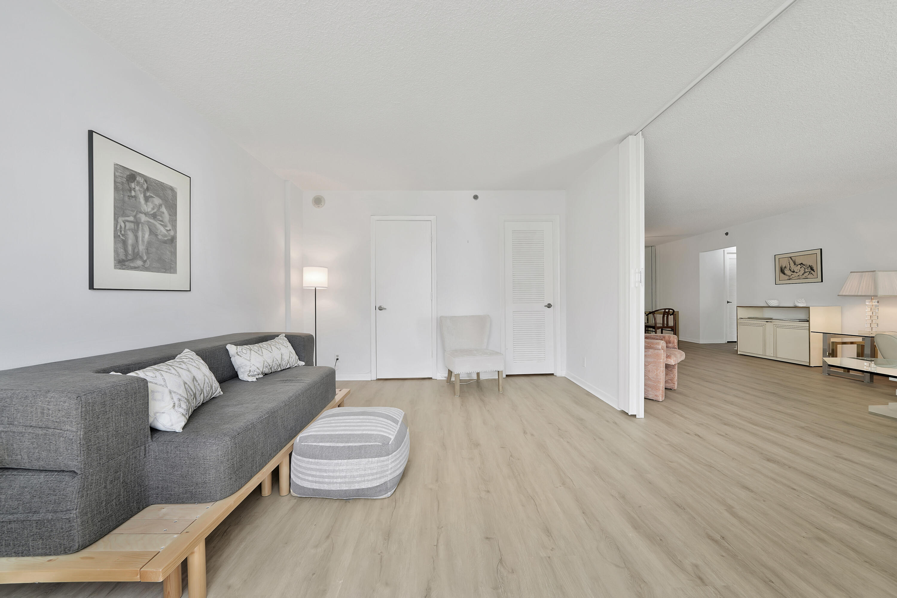 3215 South Ocean Boulevard, Unit 707 Highland Beach, FL 33487 - Photo 18 of 37 a living room with furniture and a wooden floor