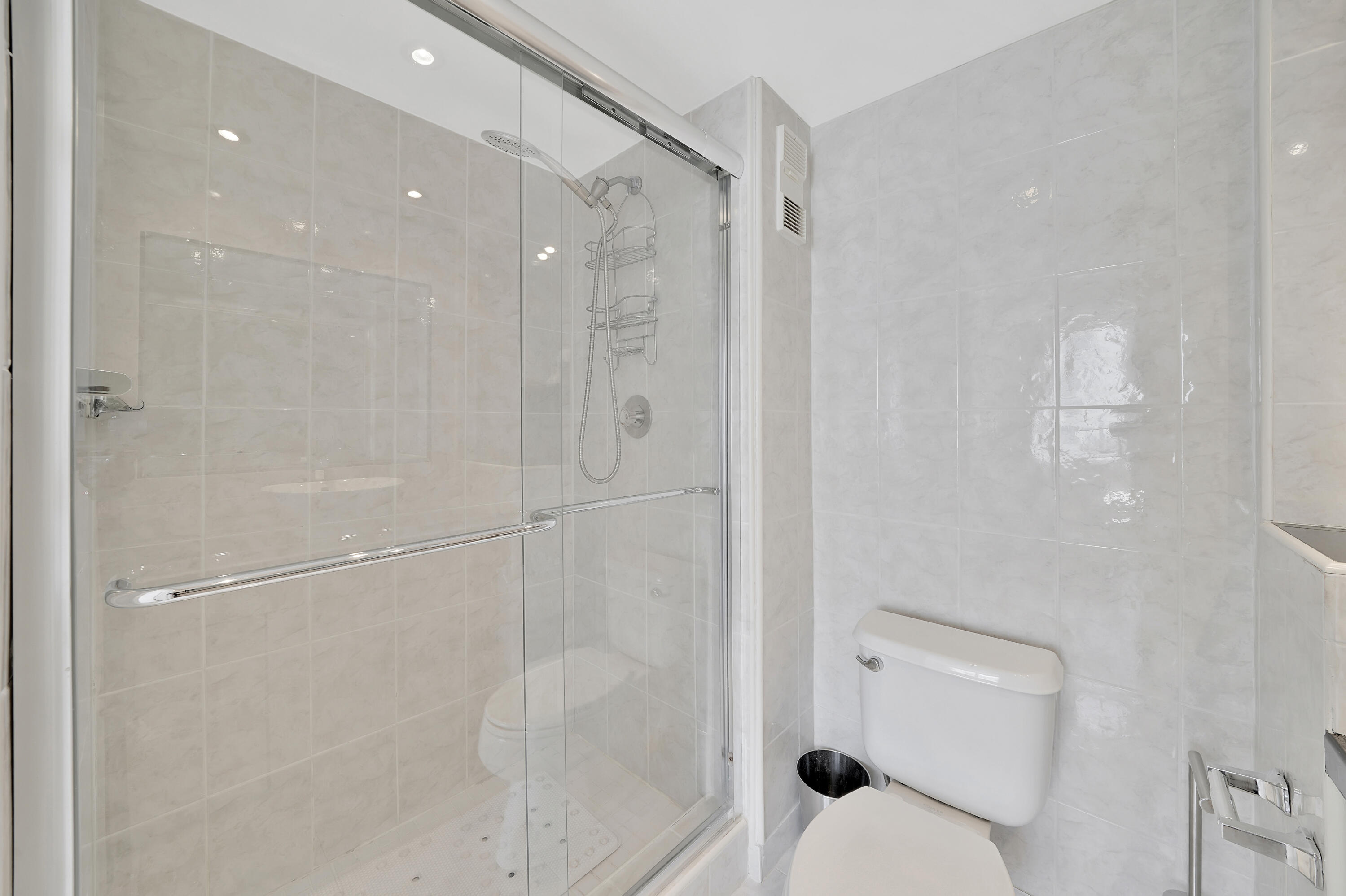 3215 South Ocean Boulevard, Unit 707 Highland Beach, FL 33487 - Photo 22 of 37 a bathroom with a shower and toilet