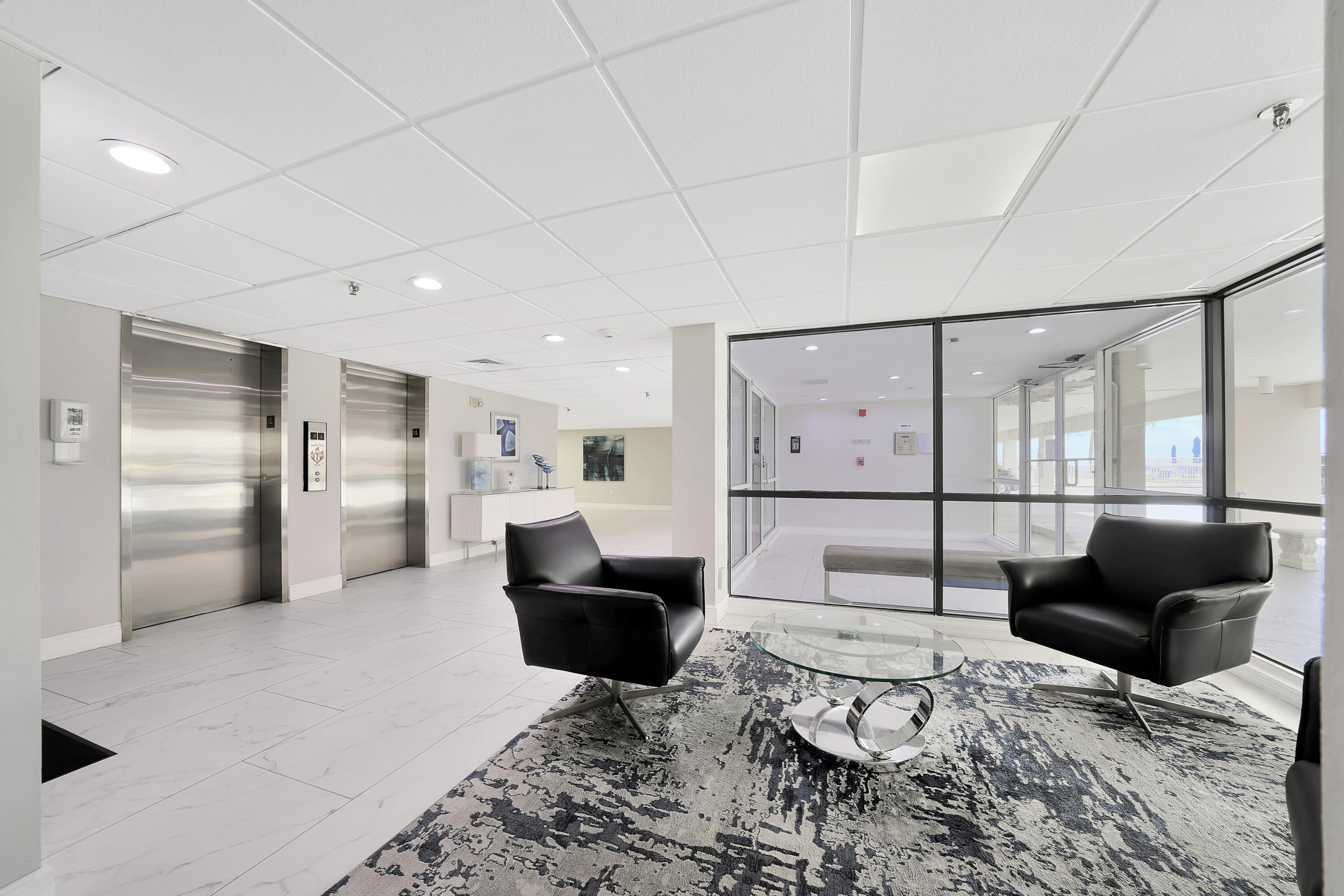 3215 South Ocean Boulevard, Unit 707 Highland Beach, FL 33487 - Photo 24 of 37 a living room with furniture and large windows
