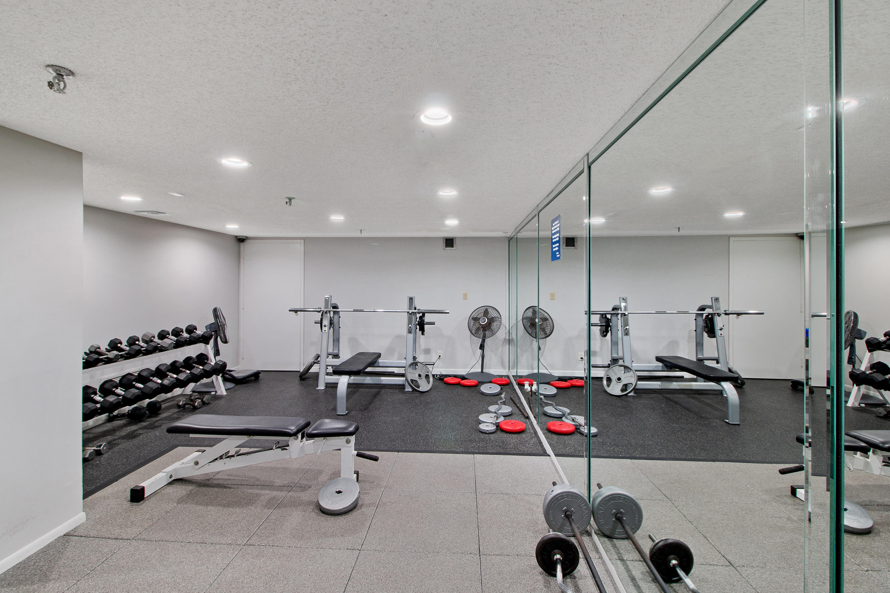 3215 South Ocean Boulevard, Unit 707 Highland Beach, FL 33487 - Photo 26 of 37 a gym room with lots of gym equipment