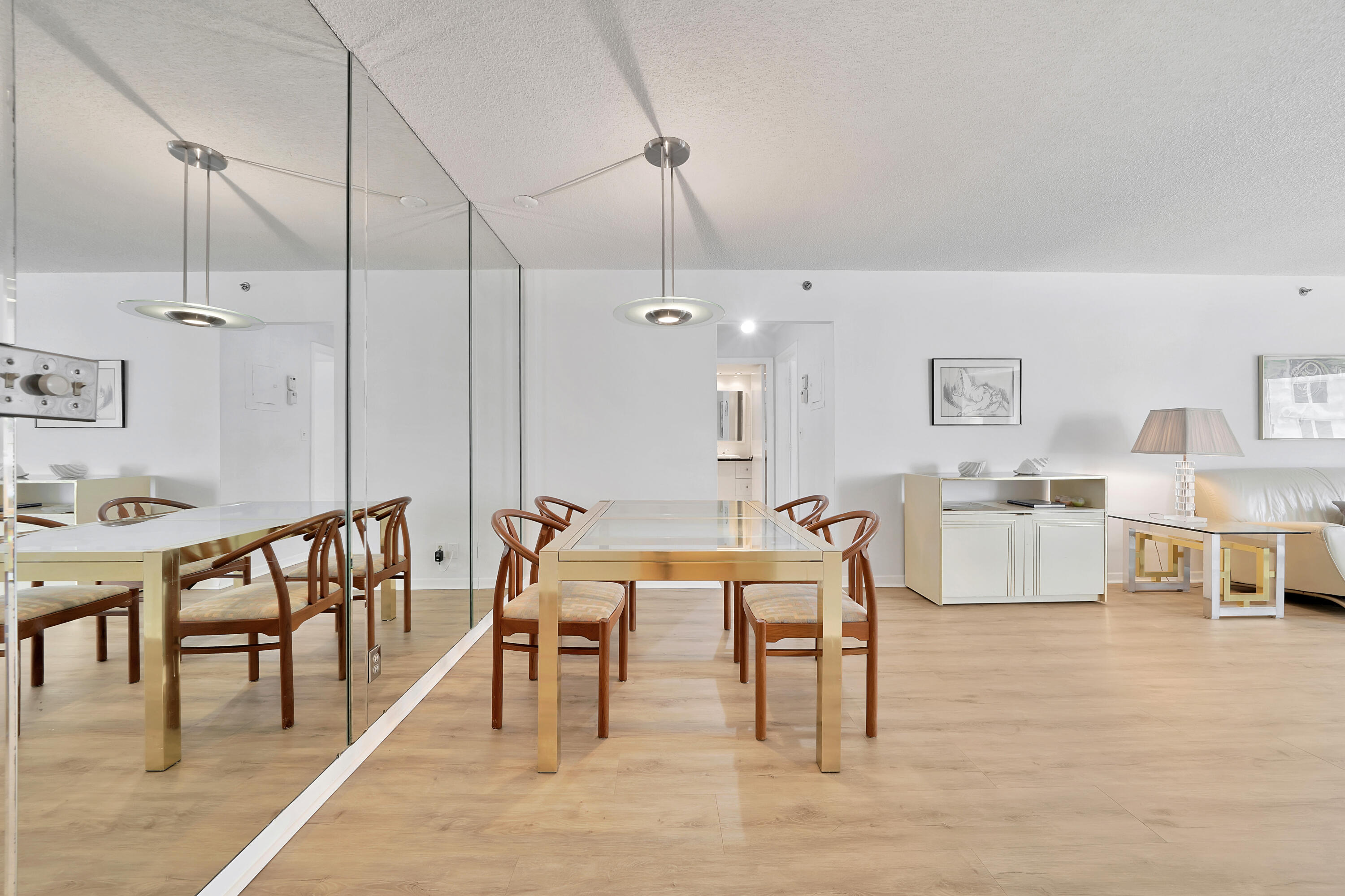 3215 South Ocean Boulevard, Unit 707 Highland Beach, FL 33487 - Photo 7 of 37 a dining room with furniture and wooden floor