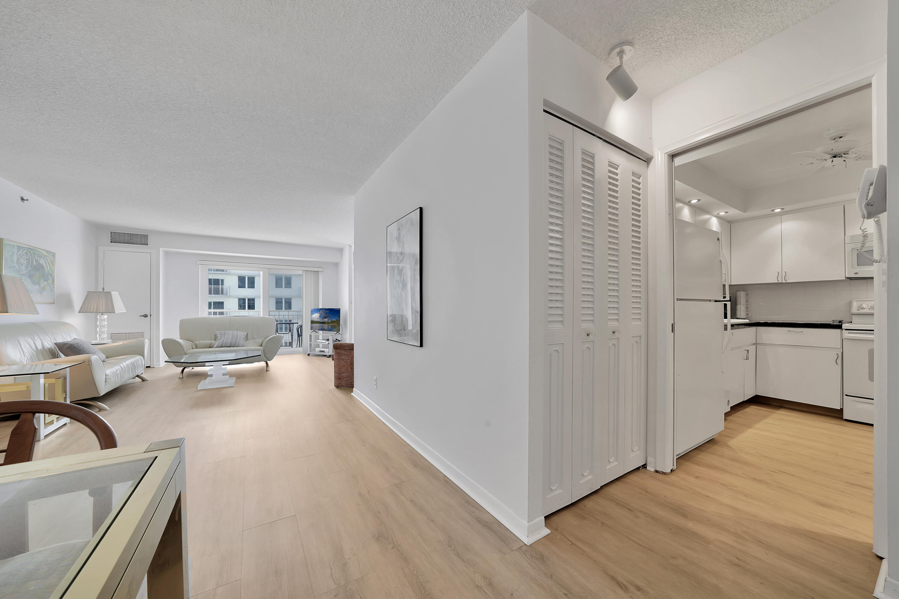 3215 South Ocean Boulevard, Unit 707 Highland Beach, FL 33487 - Photo 9 of 37 a living room with furniture and a wooden floor