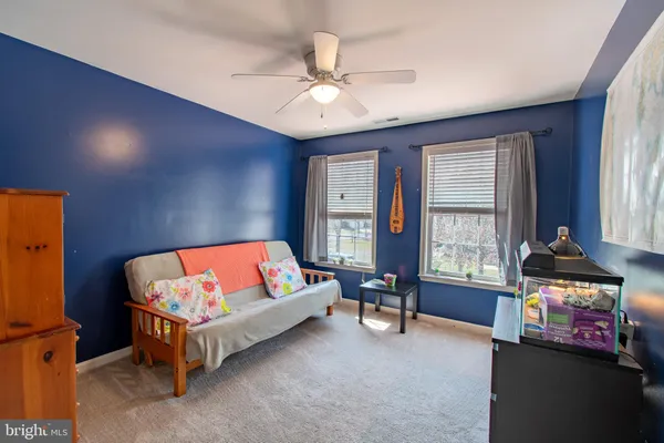 a bedroom with furniture and a chandelier