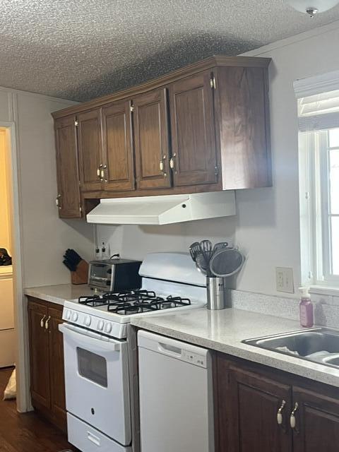 900 East Rankin Road, Unit 110 Tulare, CA 93274 - Photo 4 of 8 a kitchen with a sink cabinets and window