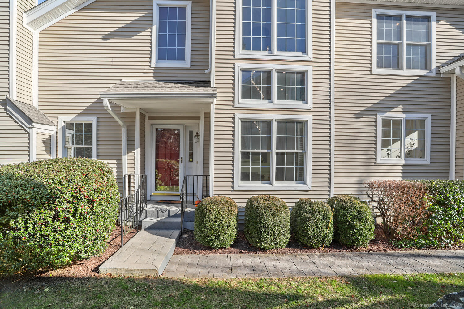 42 Regency Circle, Unit 42 Trumbull, CT 06611 - Photo 1 of 1 a front view of a house with a yard