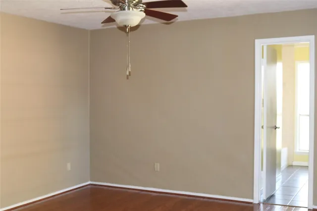 a view of a small space with wooden floor