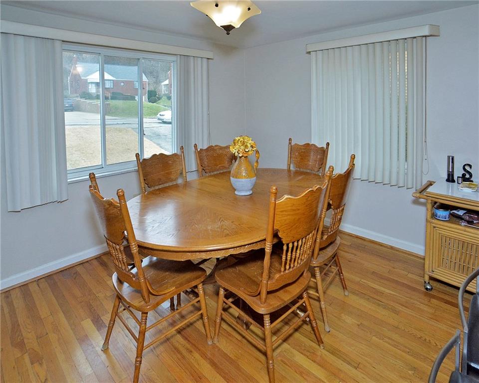 6409 Verona Road Verona, PA 15147 - Photo 7 of 21 Exposed hardwood floors in dining room area.