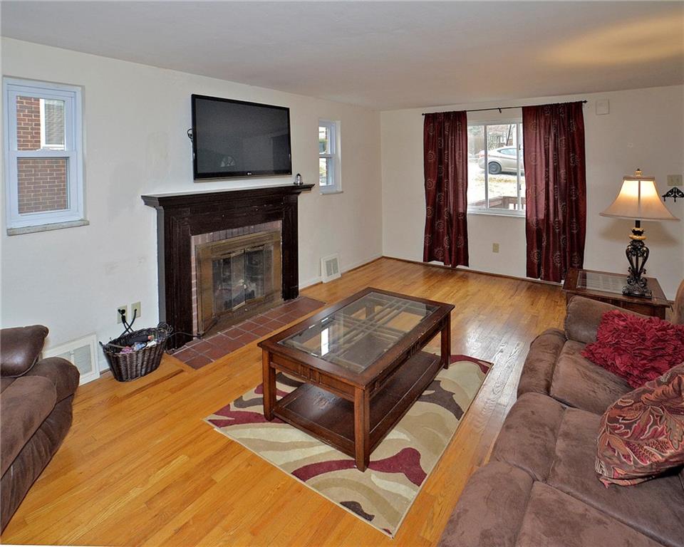 6409 Verona Road Verona, PA 15147 - Photo 9 of 21 Large living room with exposed hardwood floors.