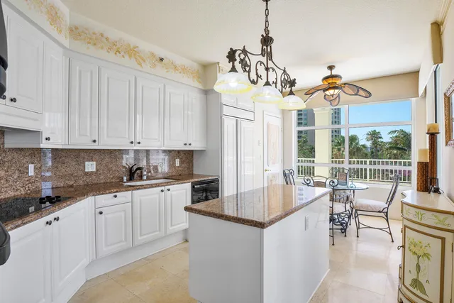 a bathroom with a sink mirror and toilet
