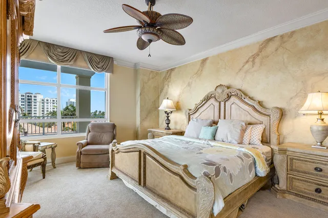 a bathroom with a granite countertop sink a mirror and a shower