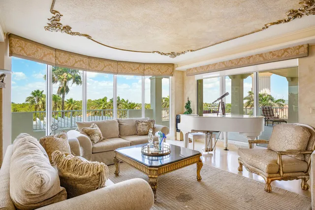 a kitchen with granite countertop a sink a counter top space appliances and cabinets