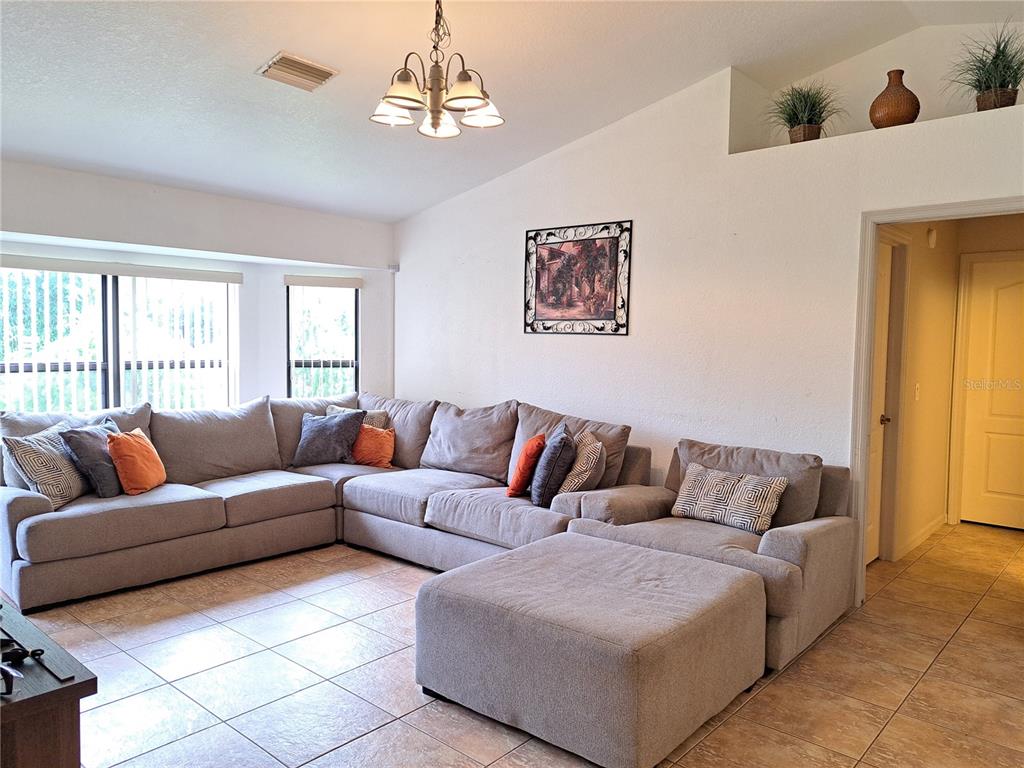 23180 Avacado Avenue Punta Gorda, FL 33980 - Photo 14 of 30 a living room with furniture and a window