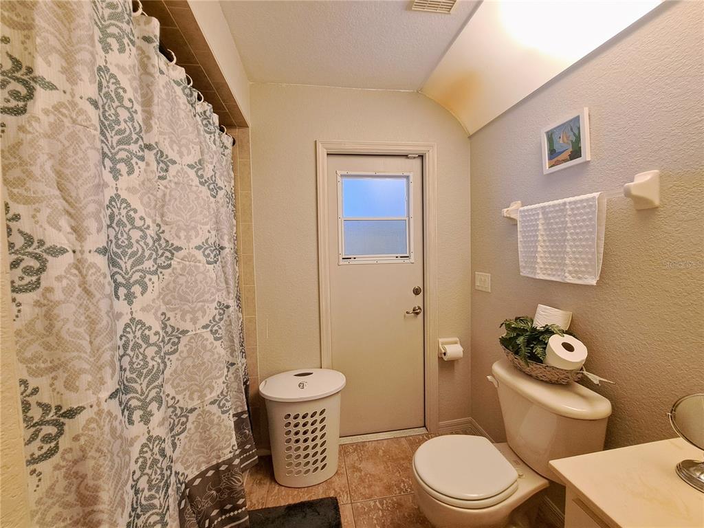 23180 Avacado Avenue Punta Gorda, FL 33980 - Photo 18 of 30 a white toilet sitting next to a bathroom sink