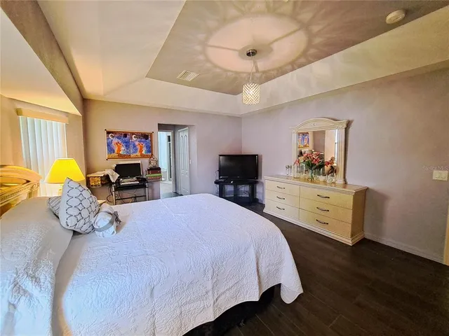 a spacious bathroom with a granite countertop sink and a mirror