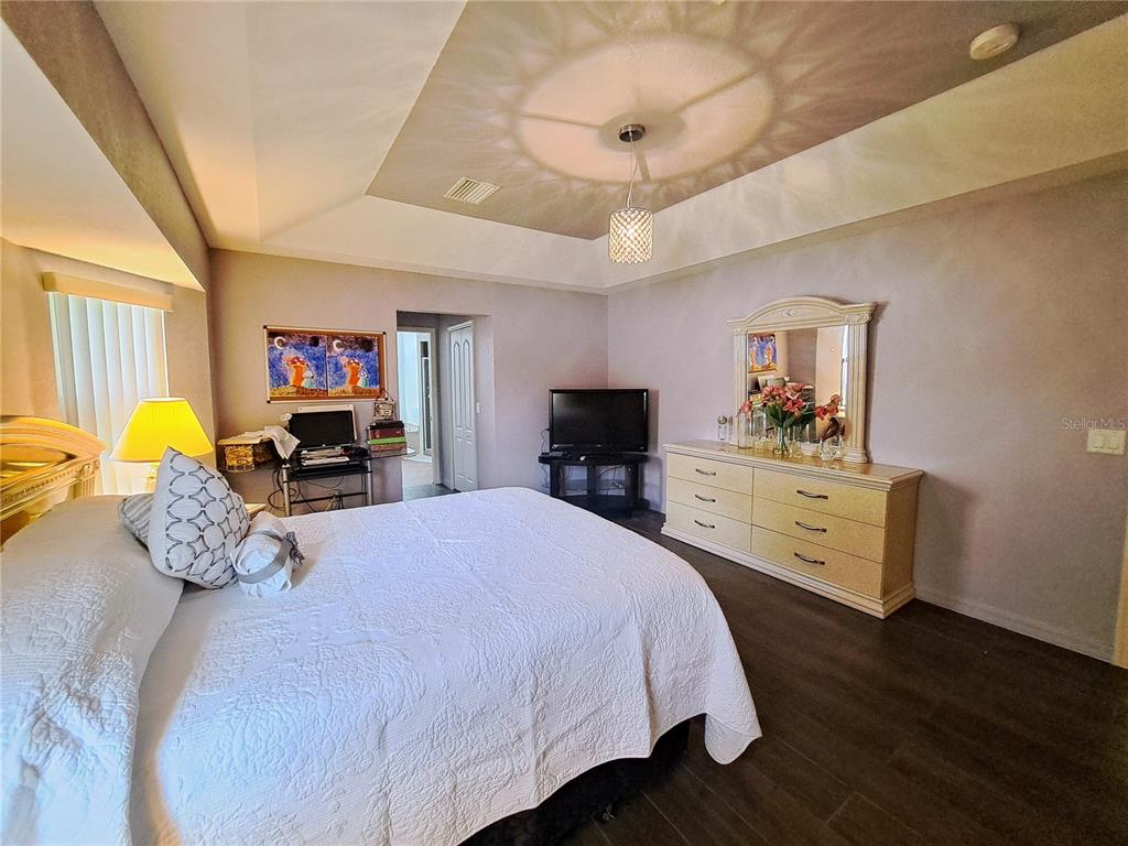 23180 Avacado Avenue Punta Gorda, FL 33980 - Photo 22 of 30 a bedroom with a bed and furniture