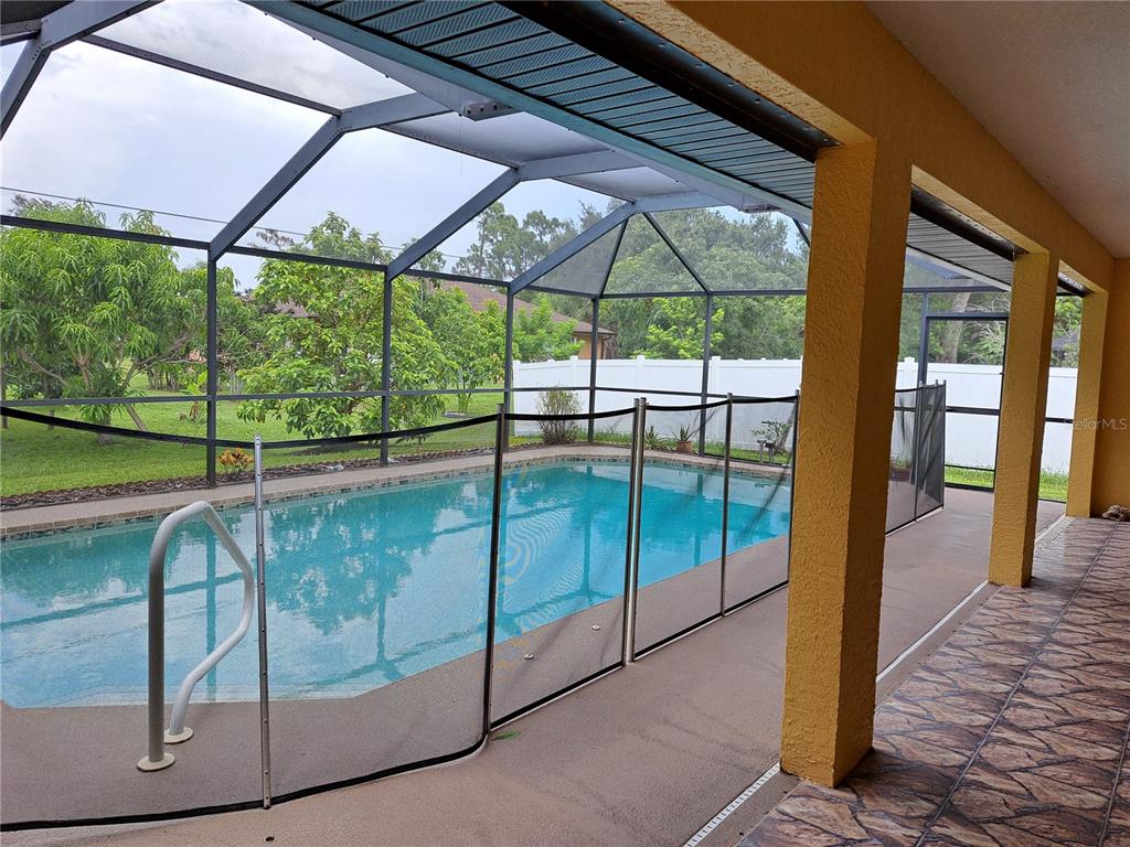 23180 Avacado Avenue Punta Gorda, FL 33980 - Photo 26 of 30 a view of a glass door with a balcony