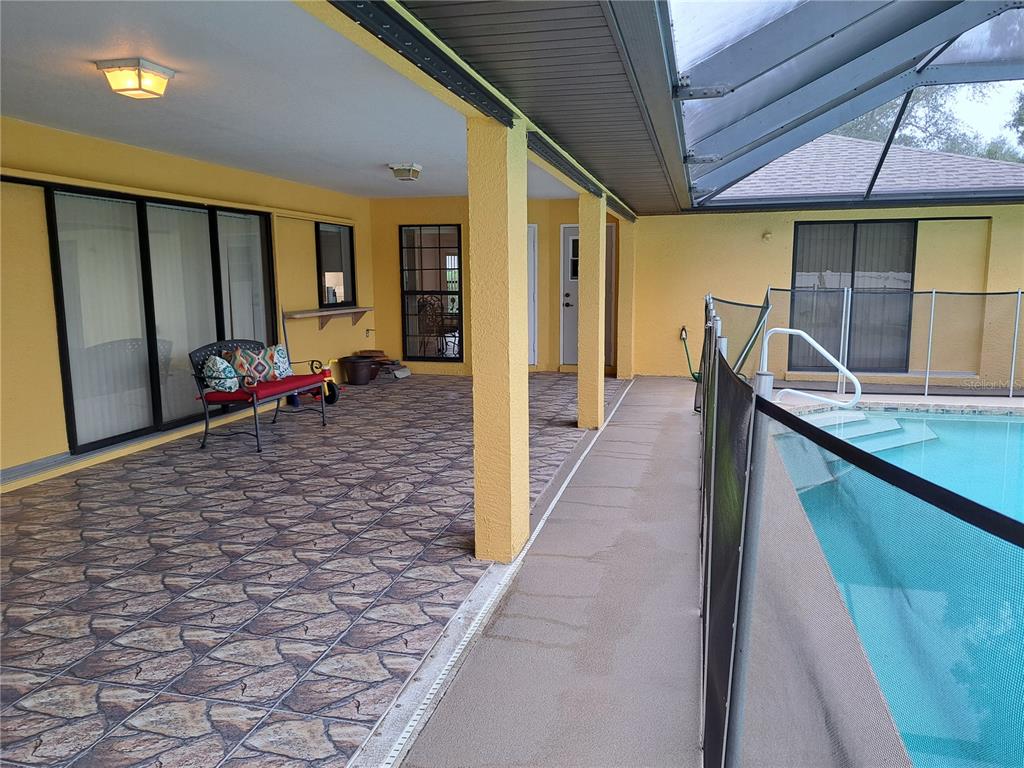 23180 Avacado Avenue Punta Gorda, FL 33980 - Photo 27 of 30 a view of a patio with table and chairs