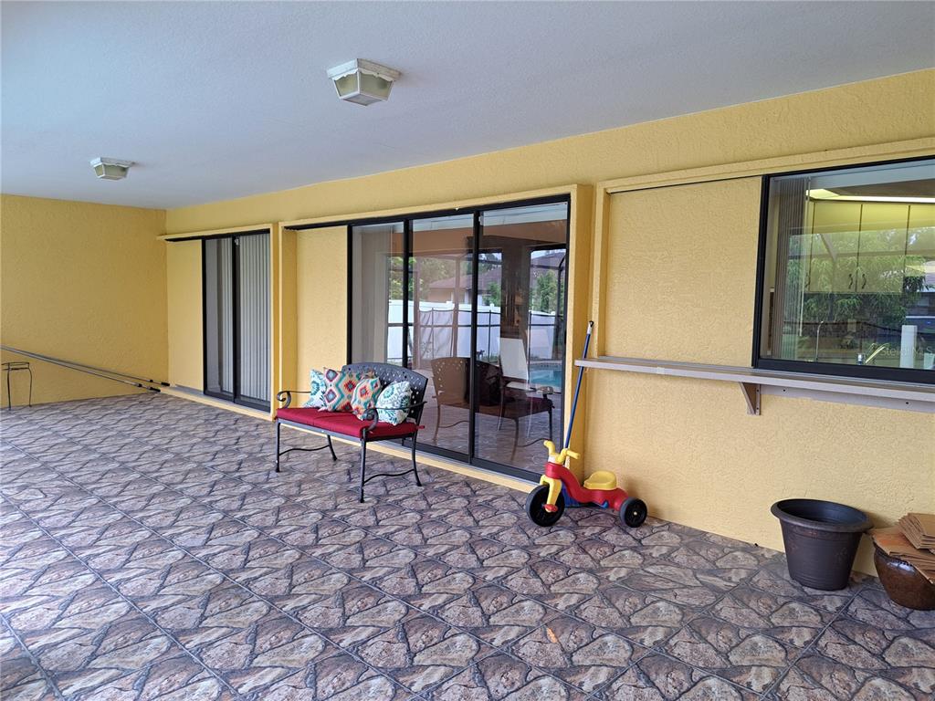 23180 Avacado Avenue Punta Gorda, FL 33980 - Photo 28 of 30 a living room with furniture and floor to ceiling window