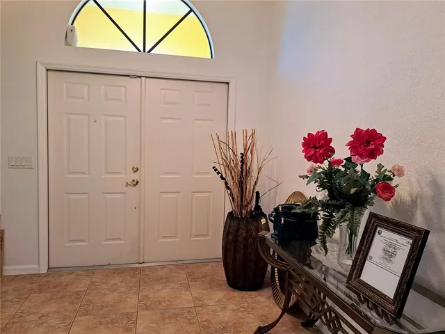a living room with furniture a rug and a window