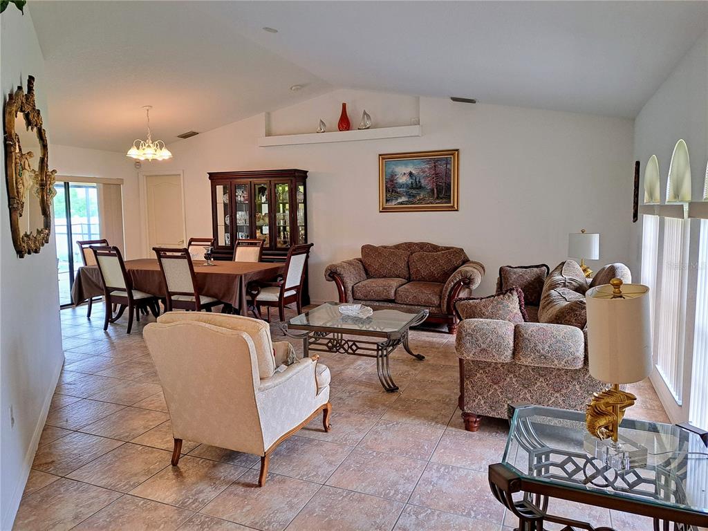 23180 Avacado Avenue Punta Gorda, FL 33980 - Photo 4 of 30 a living room with furniture a rug and a window