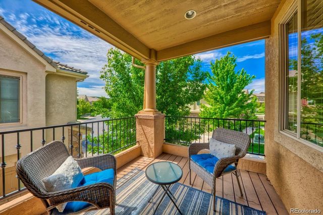 a view of balcony with furniture and wooden deck