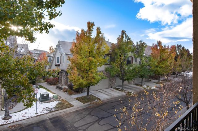 a view of a street with a building in the background