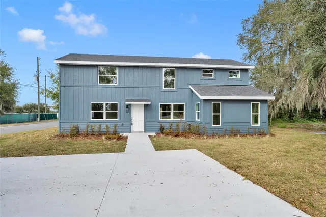 front view of a house with a yard