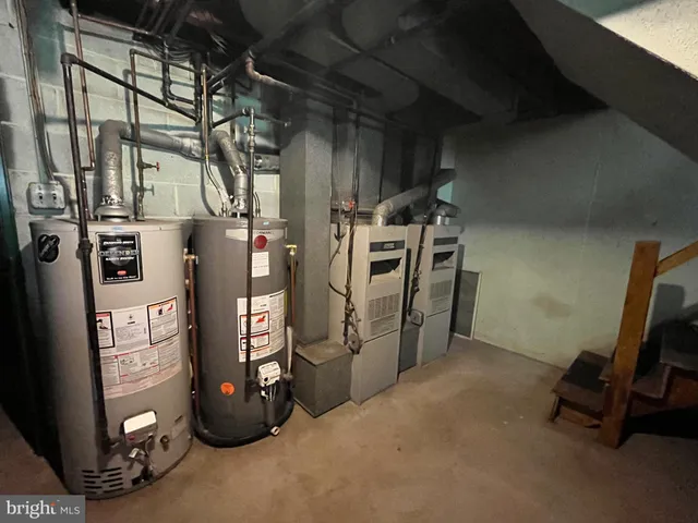 a room with table chairs and a potted plant