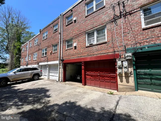 a front view of a house with barbeque