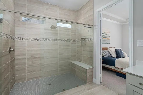 a bathroom with a bathtub and a shower