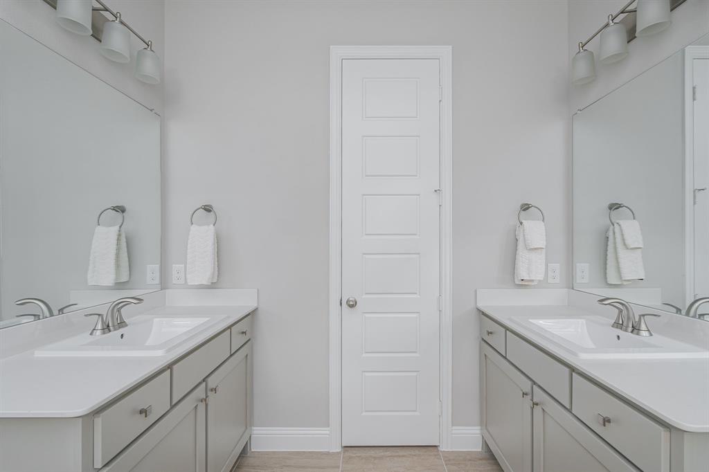 1412 Bear Path Way Gunter, TX 75058 - Photo 14 of 37 a bathroom with a sink and a mirror