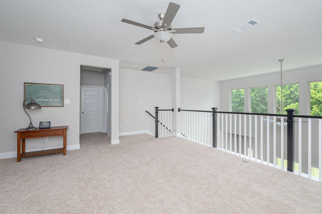1412 Bear Path Way Gunter, TX 75058 - Photo 15 of 37 a view of a livingroom with furniture and a ceiling fan