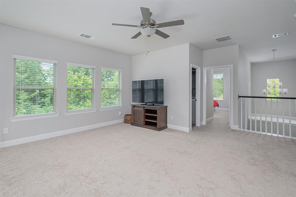 1412 Bear Path Way Gunter, TX 75058 - Photo 17 of 37 a view of a livingroom with furniture and a ceiling fan