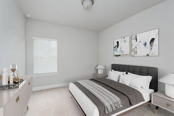a bedroom with a bed and window