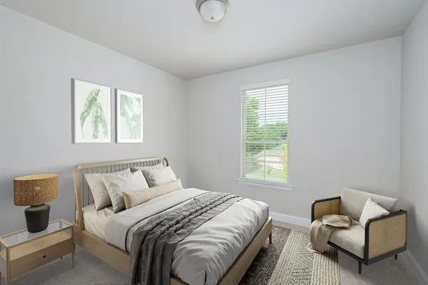 a bedroom with bed and a couch