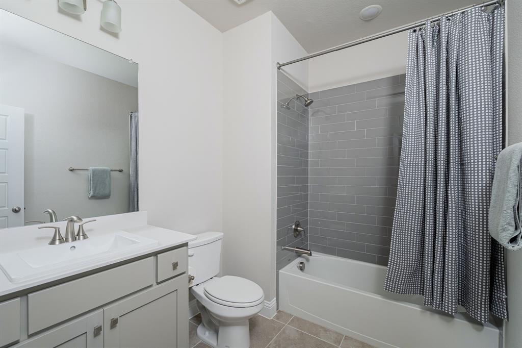 1412 Bear Path Way Gunter, TX 75058 - Photo 21 of 37 a bathroom with a sink toilet and shower