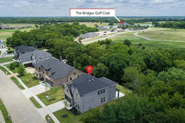 an aerial view of a house with yard swimming pool and outdoor seating