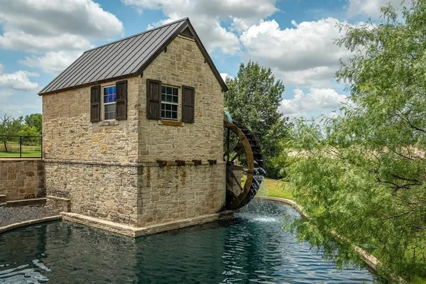 a house with river in front of it