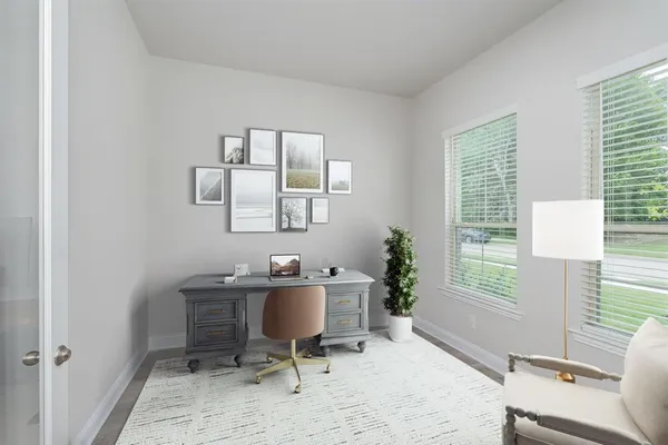 a workspace with furniture and a window