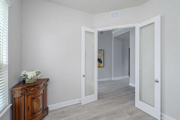 a view of an entryway with wooden floor
