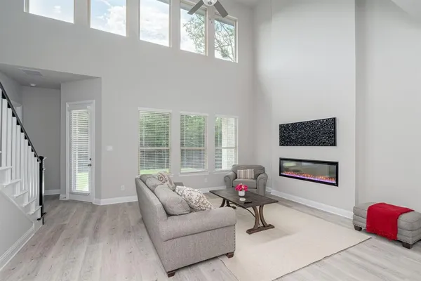 a living room with furniture and a large window